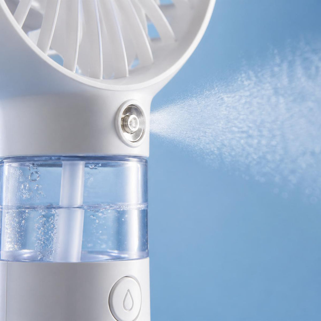 Handheld mist fan nozzle and water reservoir close-up