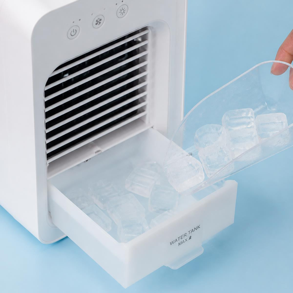 Mini air conditioner water tank being filled with ice